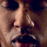 drops of water on face of black guy / Menschen