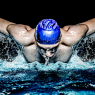 Muscular young man in blue cap in swimming pool / Sport